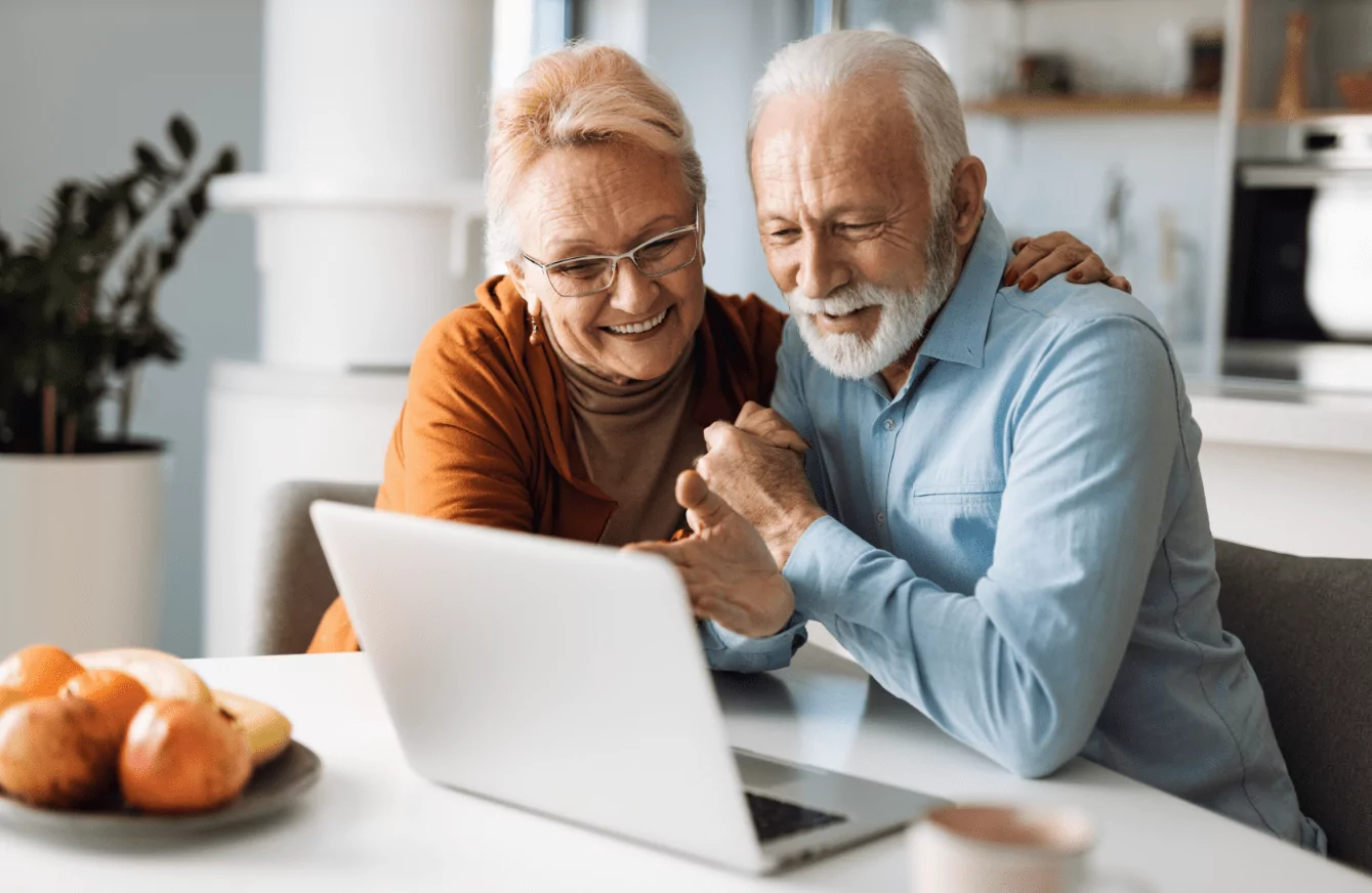 old couple looking at laptop