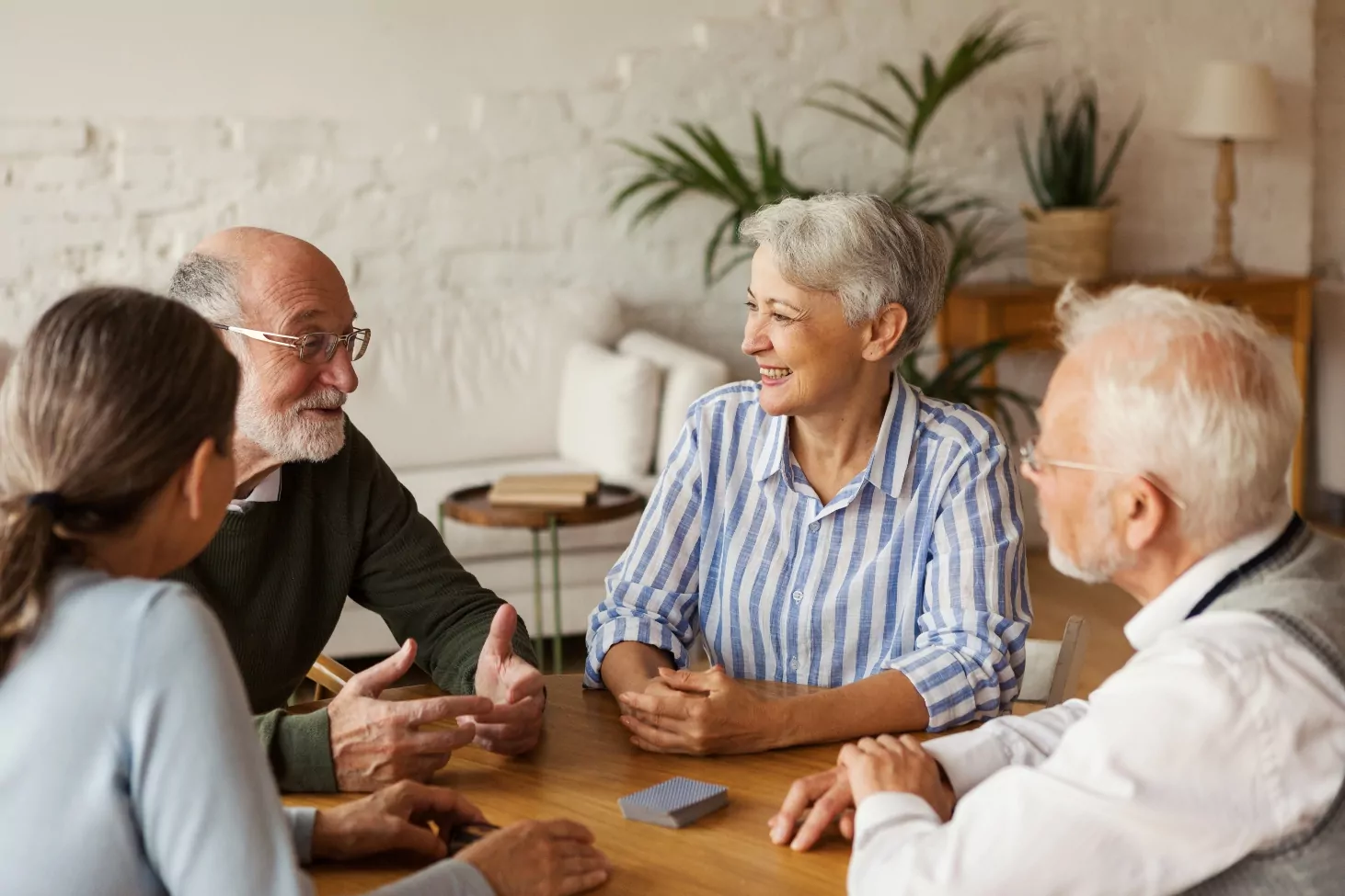 seniors talking and playing cards